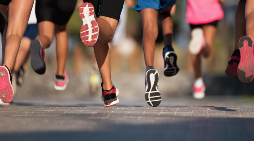 runners running side by side outside
