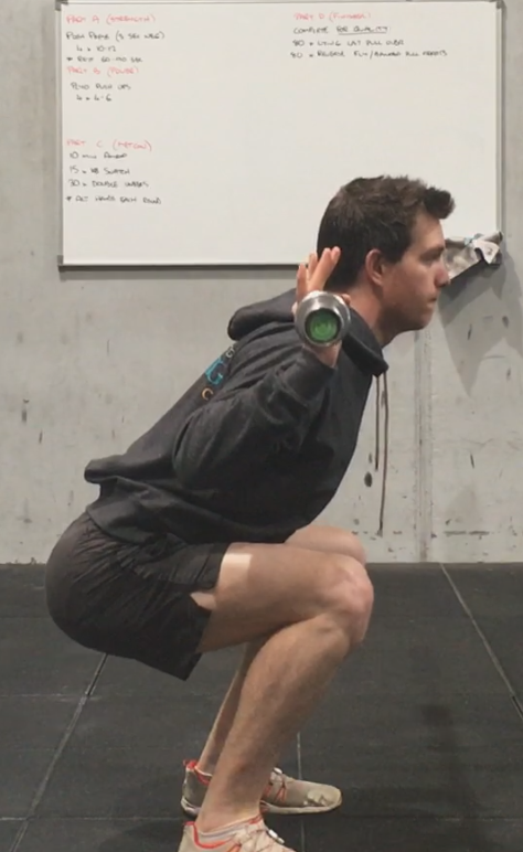 strong runner doing squats