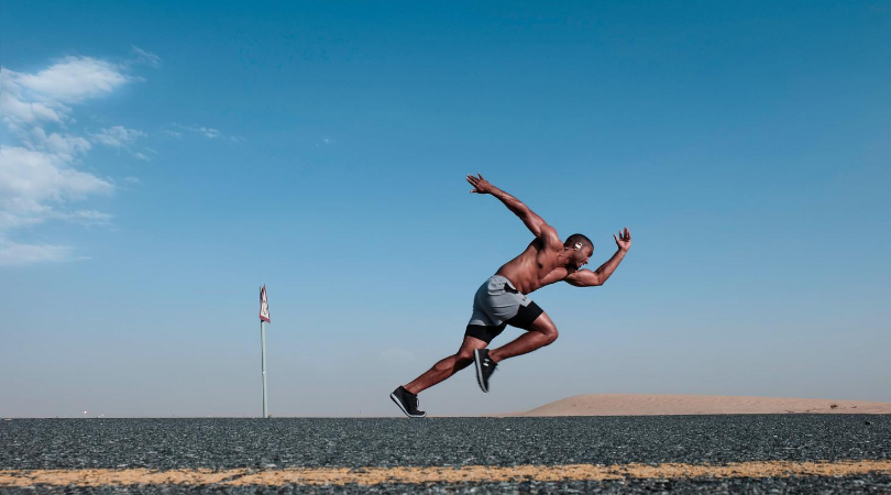 Runner running fast increasing performance in minimalist shoes