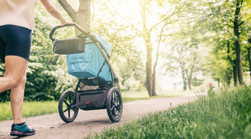 mum walking while pushing stroller