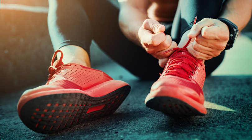 runner putting on running shoes