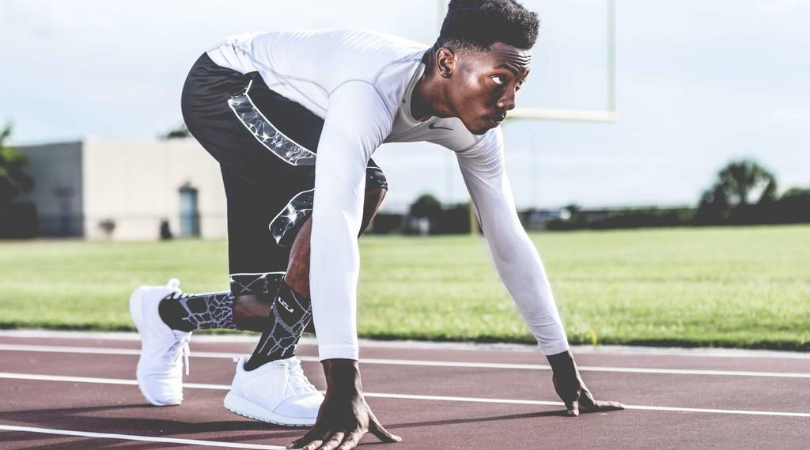 Runner ready to start running from the blocks