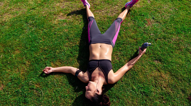 runner tired after a long run on the grass