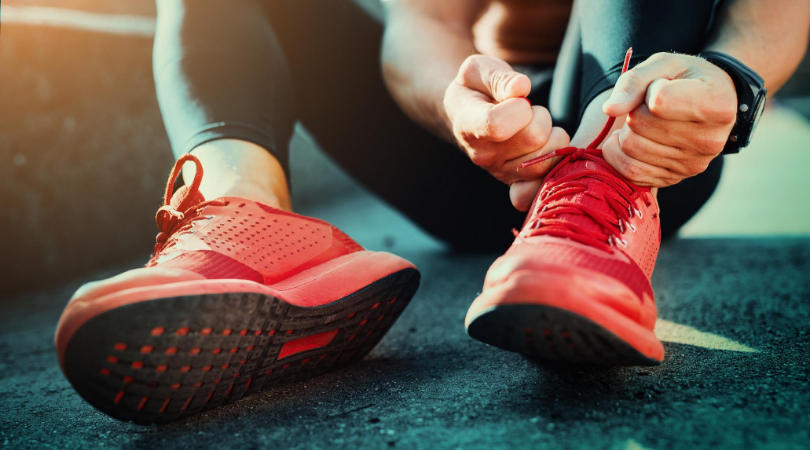 runner putting on running shoes