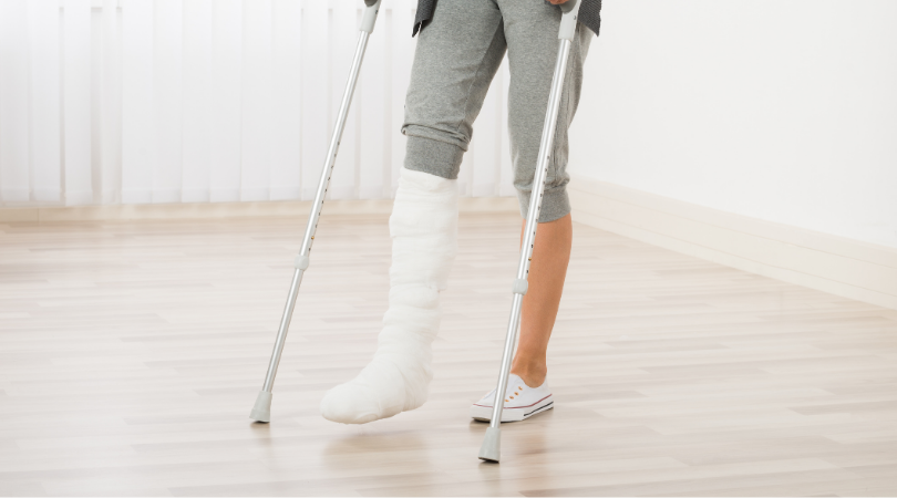 runner on crutches with a cast on her foot after suffering stress fracture