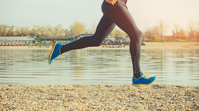 Runner running on sand surface