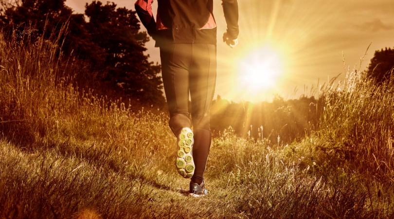 Runner running on grass surface